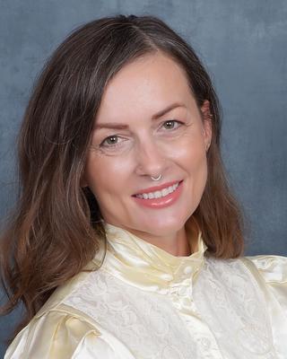 Headshot of Diana Mujkanović.