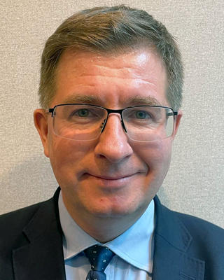 Headshot of Mateusz Stąsiek.