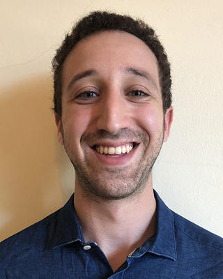 Headshot of Michael Zanger-Tishler.