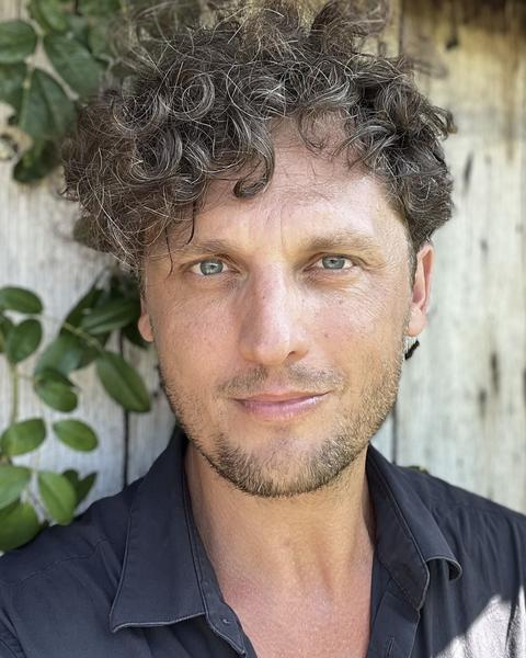Headshot of Dominik Bartmański.