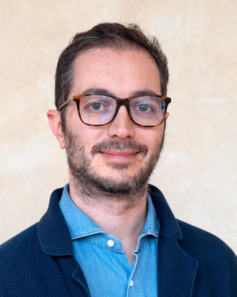 Headshot of Gianluca Busilacchi.