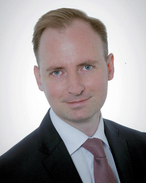 Headshot of Michał Chabros.